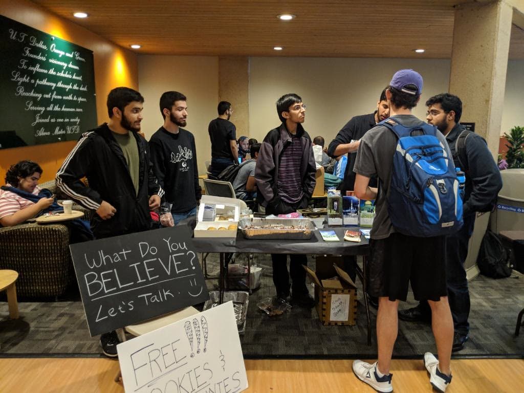 Students at a community outreach table